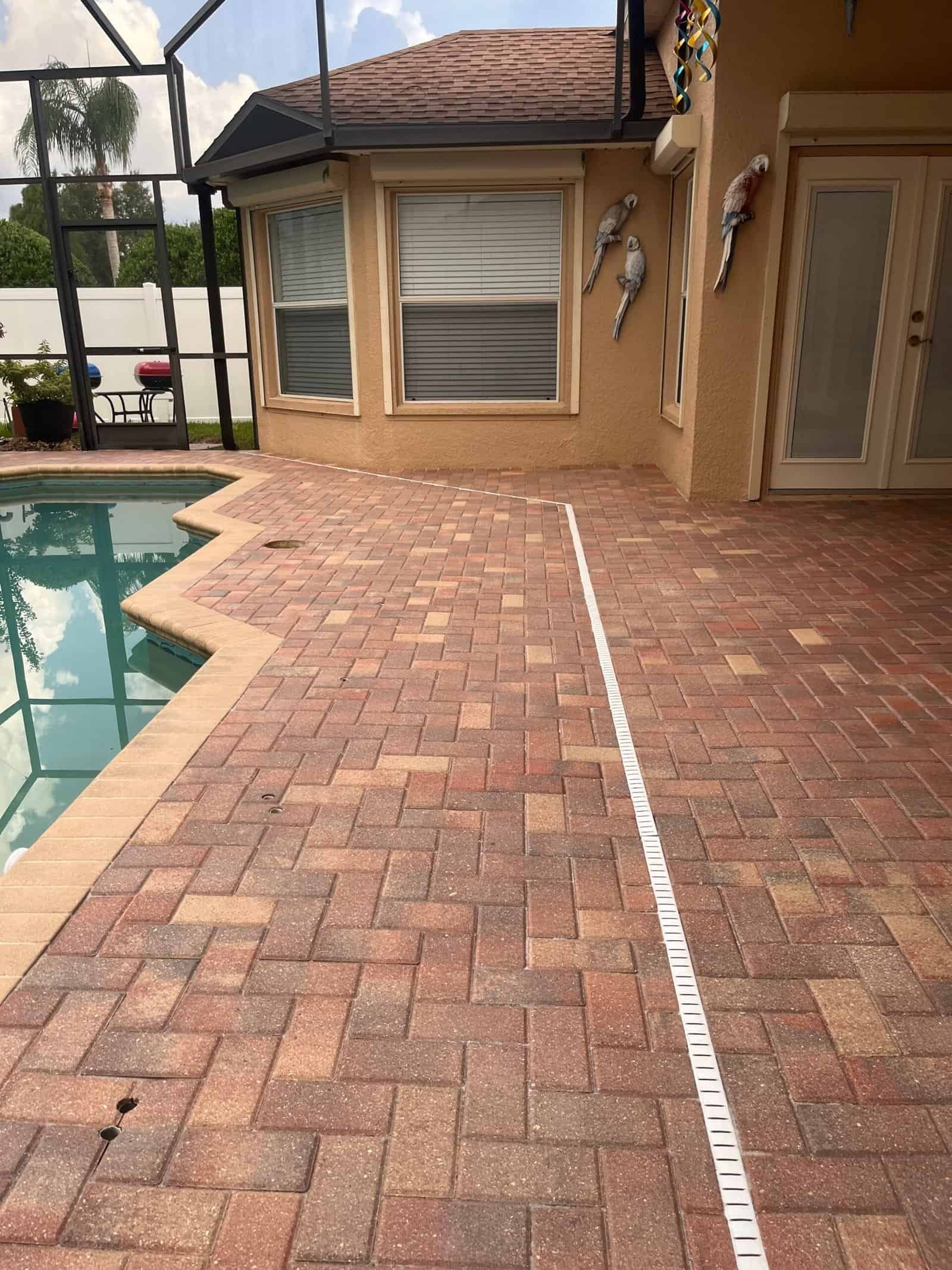 After pool patio cleaning in St Cloud FL – clean, safe deck by Baha Softwash’s soft wash method.